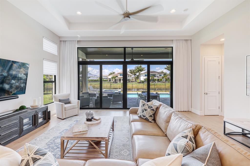 17401 Santaluce Manor Boca Raton, FL 33496 - Photo 14 of 84 a living room with furniture and a flat screen tv