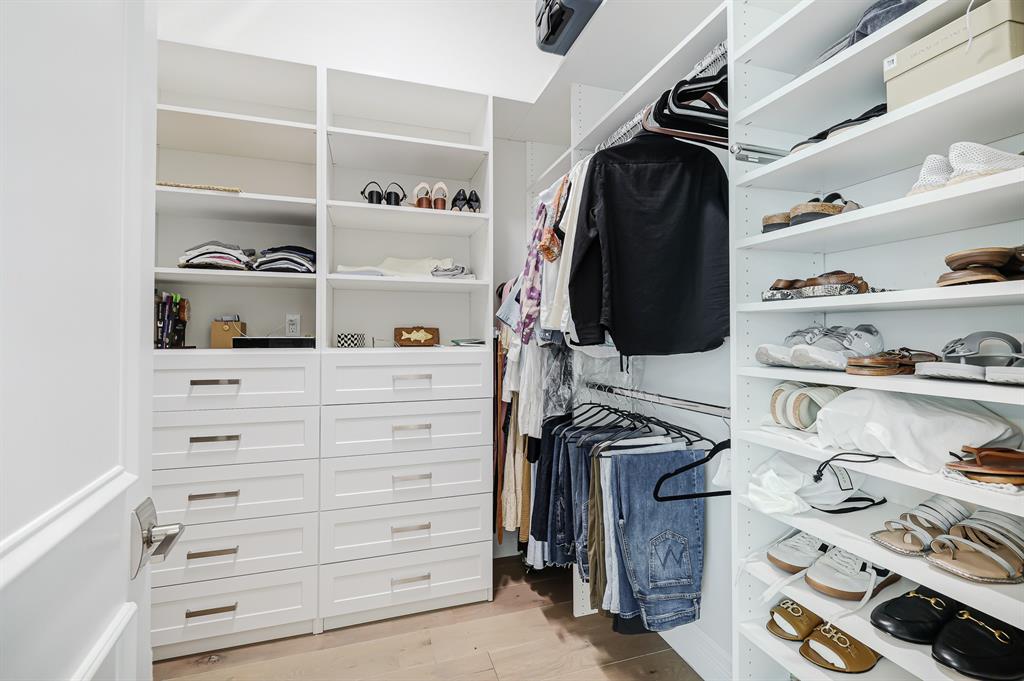 17401 Santaluce Manor Boca Raton, FL 33496 - Photo 34 of 84 a view of walk in closet with clothes and shoes