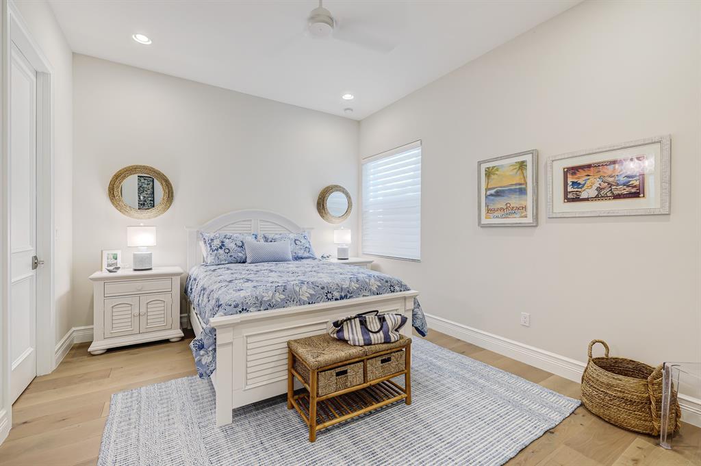 17401 Santaluce Manor Boca Raton, FL 33496 - Photo 35 of 84 a bedroom with a bed and a table