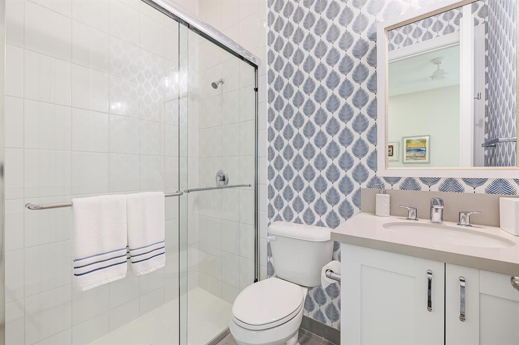 17401 Santaluce Manor Boca Raton, FL 33496 - Photo 40 of 84 a bathroom with a sink toilet and shower