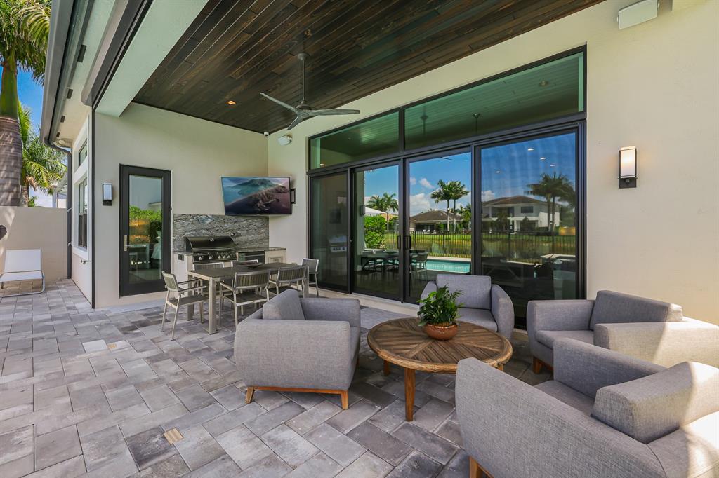 17401 Santaluce Manor Boca Raton, FL 33496 - Photo 44 of 84 a living room with furniture and a large window