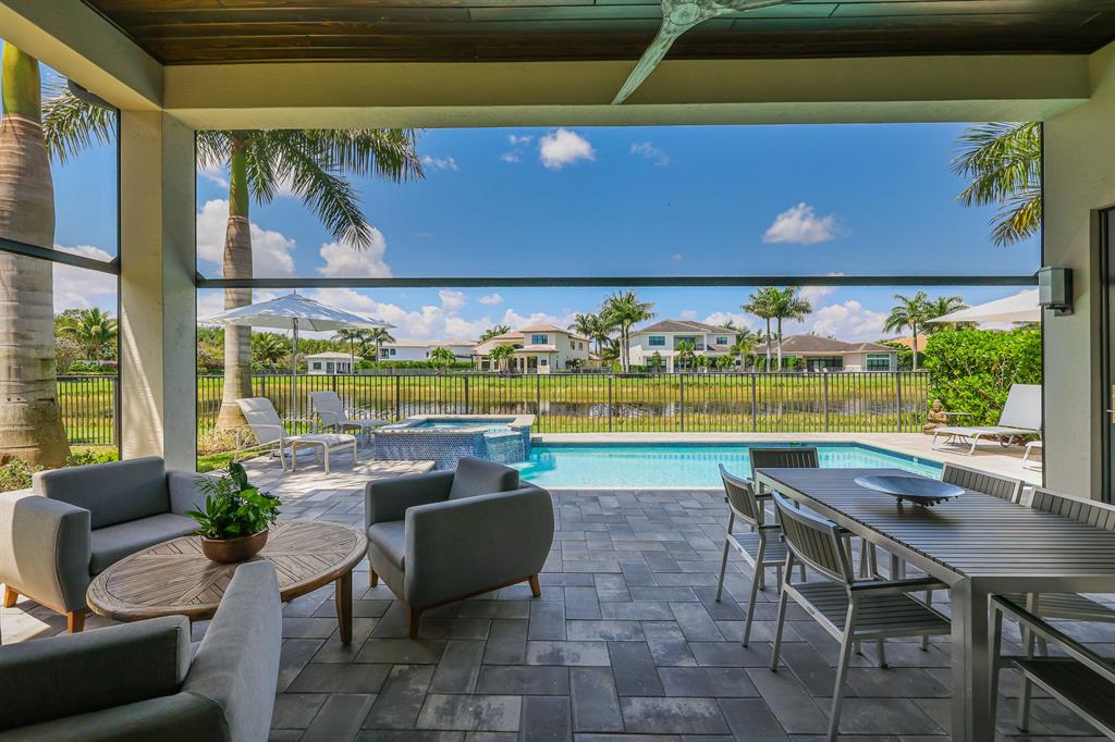 17401 Santaluce Manor Boca Raton, FL 33496 - Photo 45 of 84 a view of swimming pool with outdoor seating and yard