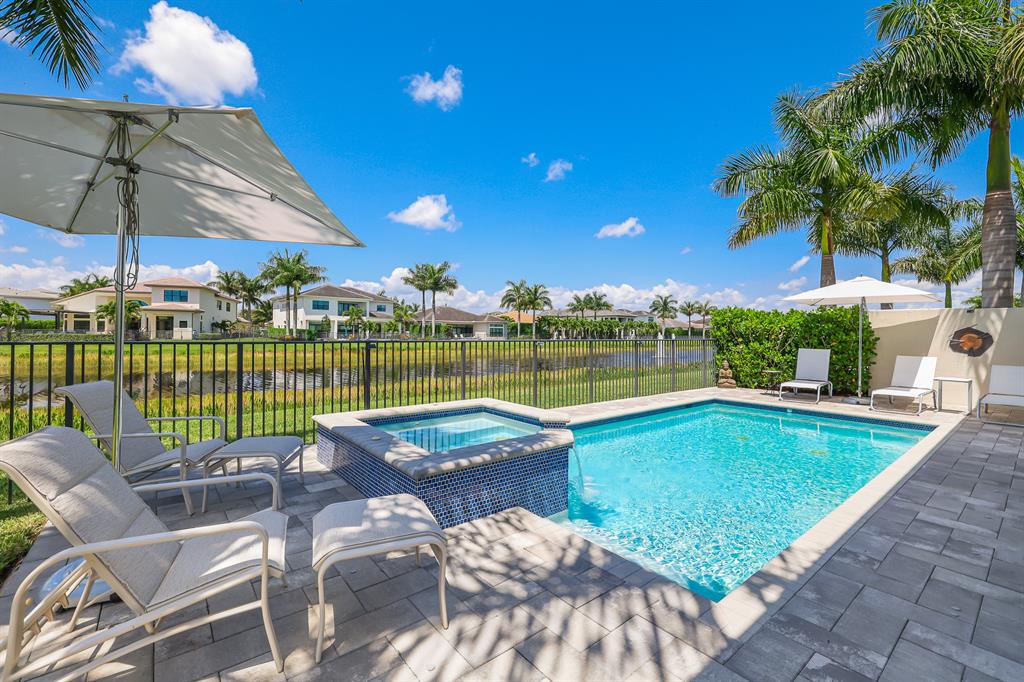 17401 Santaluce Manor Boca Raton, FL 33496 - Photo 53 of 84 a view of a swimming pool with a patio