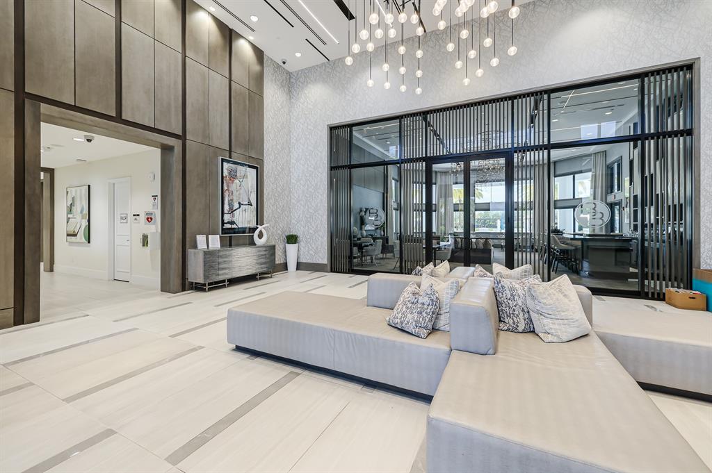 17401 Santaluce Manor Boca Raton, FL 33496 - Photo 75 of 84 a spacious bedroom with a large bed and a large window