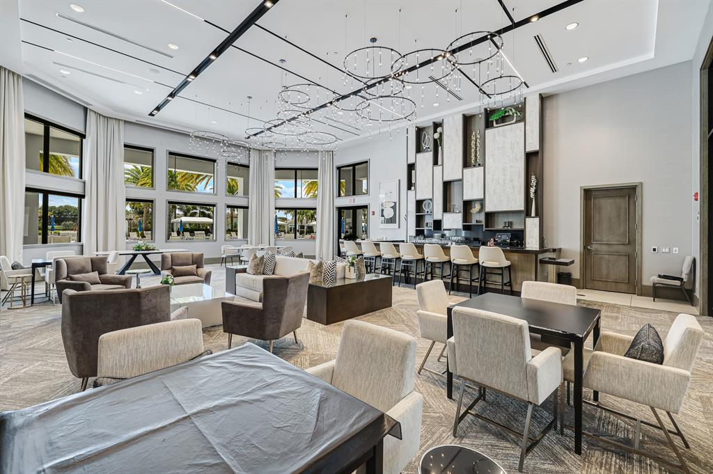 17401 Santaluce Manor Boca Raton, FL 33496 - Photo 76 of 84 a view of a dining room with furniture window and wooden floor
