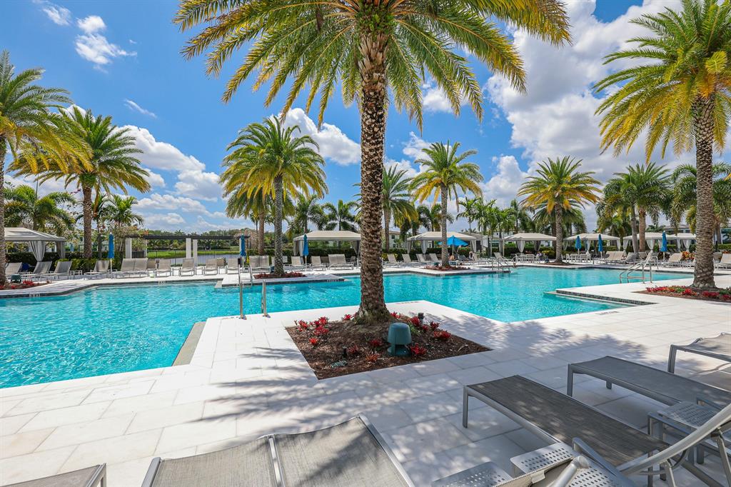 17401 Santaluce Manor Boca Raton, FL 33496 - Photo 78 of 84 a view of a swimming pool with a table and chairs