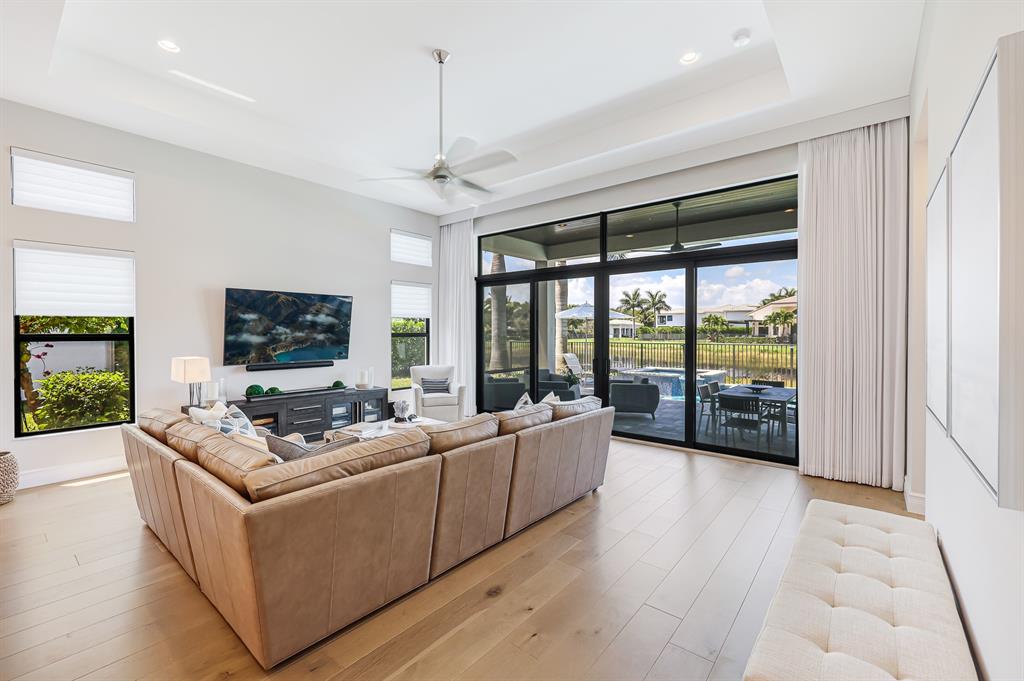 17401 Santaluce Manor Boca Raton, FL 33496 - Photo 9 of 84 a living room with furniture large window and a flat screen tv
