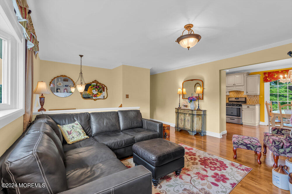 54 Salem Hill Road Howell, NJ 07731 - Photo 12 of 71 a living room with furniture and a rug
