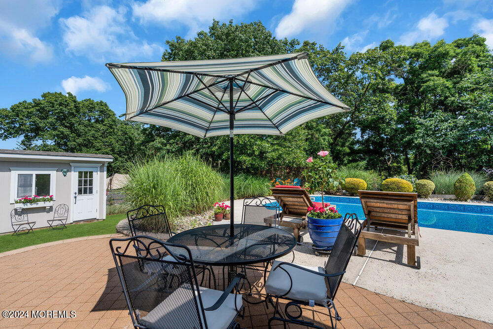 54 Salem Hill Road Howell, NJ 07731 - Photo 3 of 71 a view of an outdoor sitting area with furniture and wooden floor
