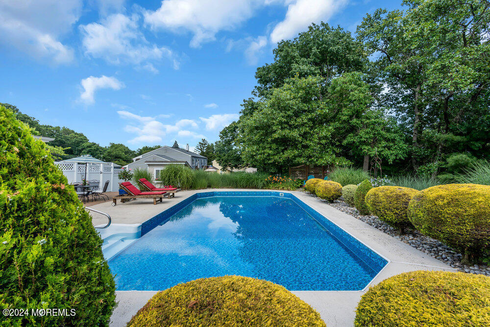 54 Salem Hill Road Howell, NJ 07731 - Photo 57 of 71 a view of swimming pool with seating space