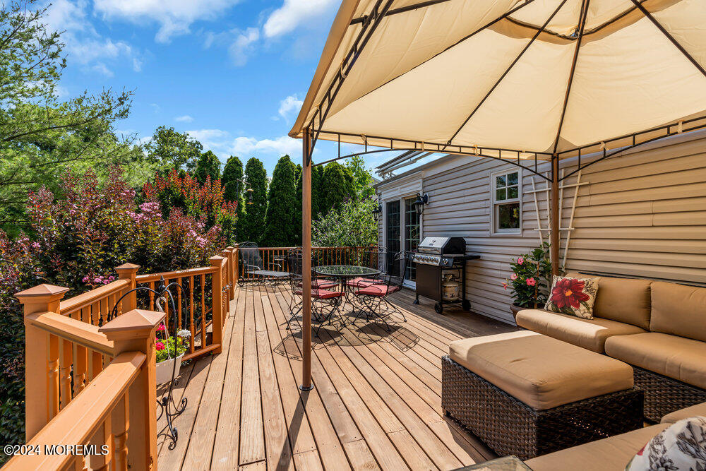 54 Salem Hill Road Howell, NJ 07731 - Photo 70 of 71 a view of a roof deck with couches and potted plants