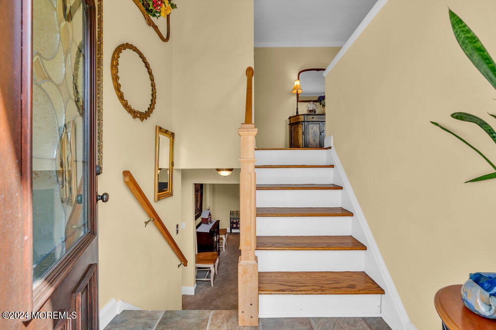 54 Salem Hill Road Howell, NJ 07731 - Photo 8 of 71 a view of entryway with wooden floor and a front door