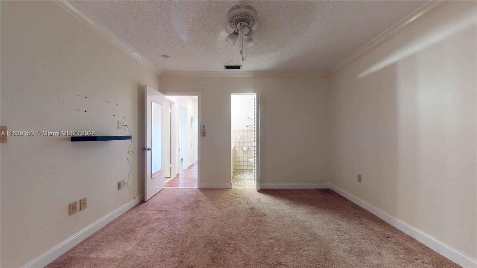 10665 Southwest 113th Place, Unit 95D Miami, FL 33176 - Photo 17 of 42 a view of a hallway with closet