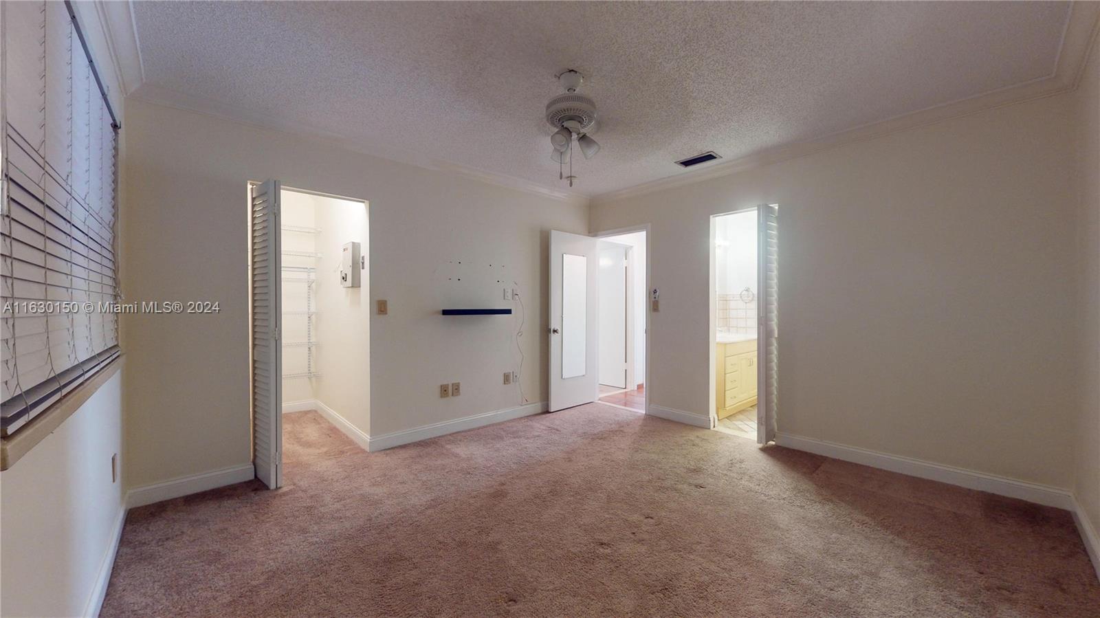 10665 Southwest 113th Place, Unit 95D Miami, FL 33176 - Photo 18 of 42 an empty room with a bathroom