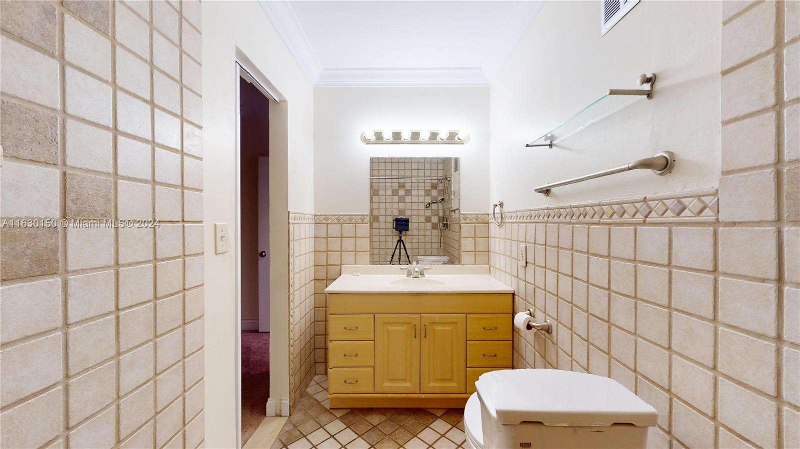 10665 Southwest 113th Place, Unit 95D Miami, FL 33176 - Photo 20 of 42 a bathroom with a sink toilet and shower