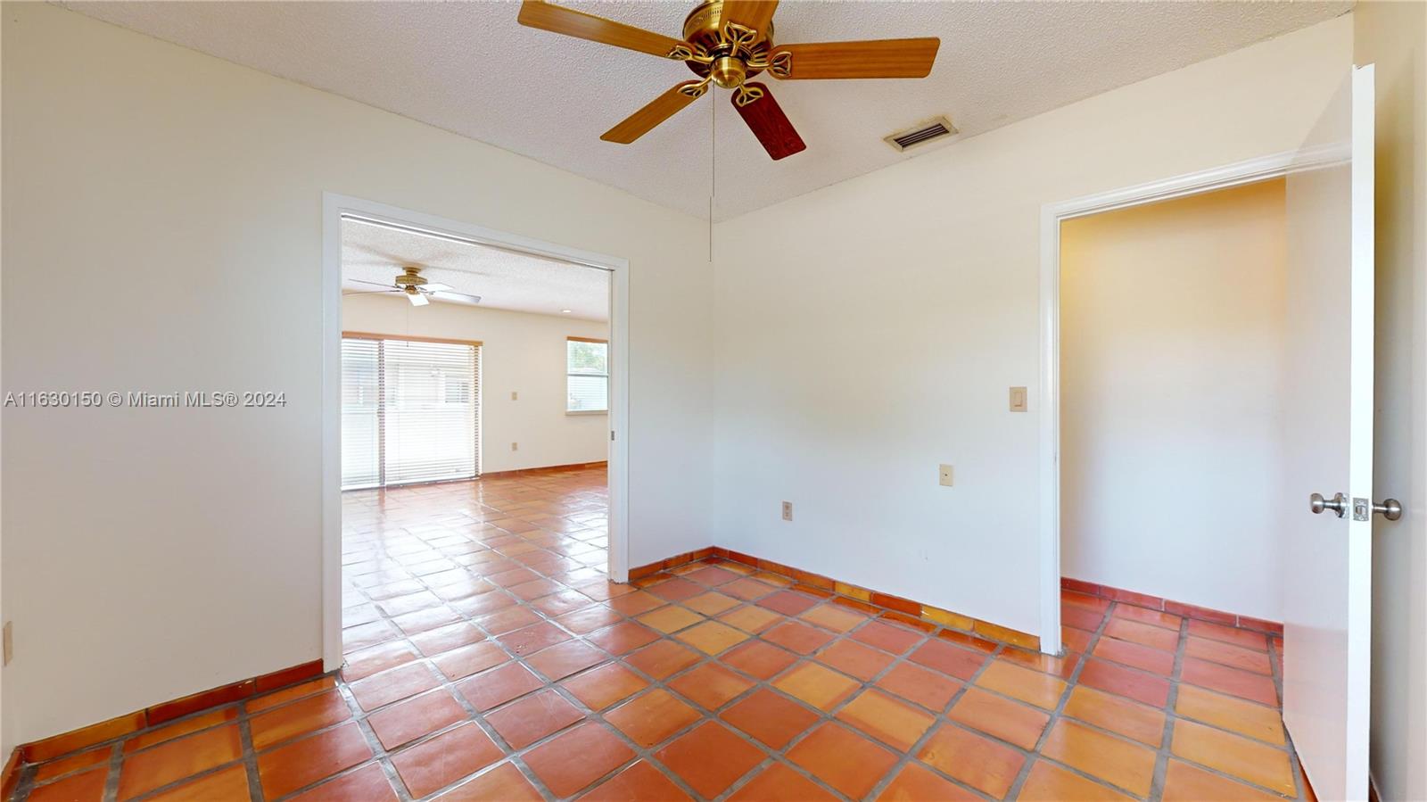 10665 Southwest 113th Place, Unit 95D Miami, FL 33176 - Photo 26 of 42 a view of a room with wooden floor and cabinet