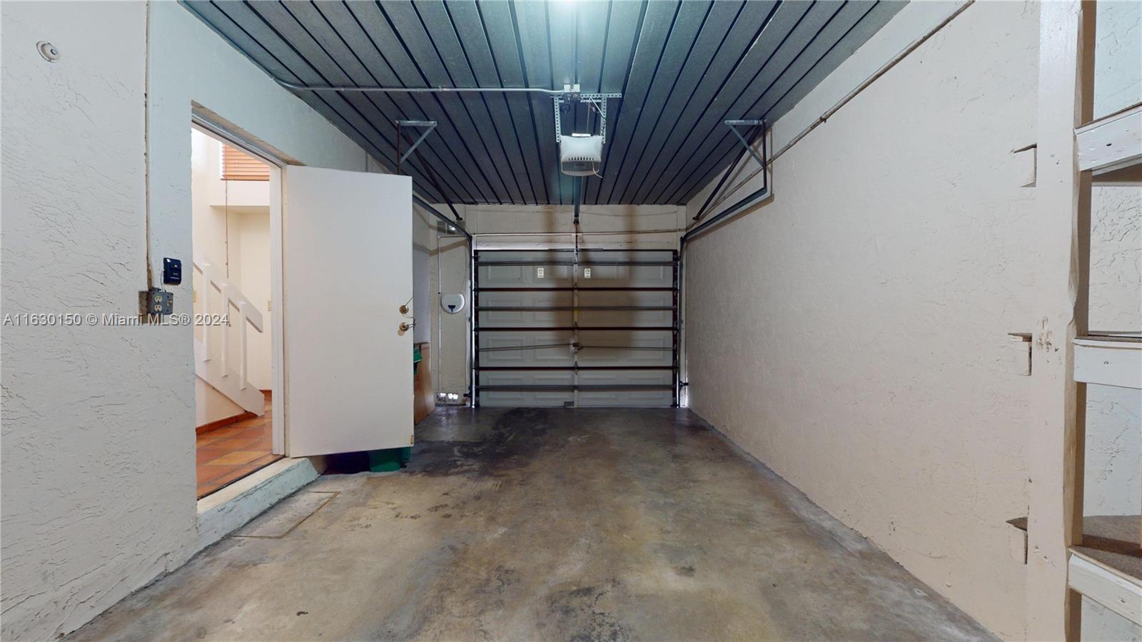 10665 Southwest 113th Place, Unit 95D Miami, FL 33176 - Photo 28 of 42 a view of an empty room with a fireplace