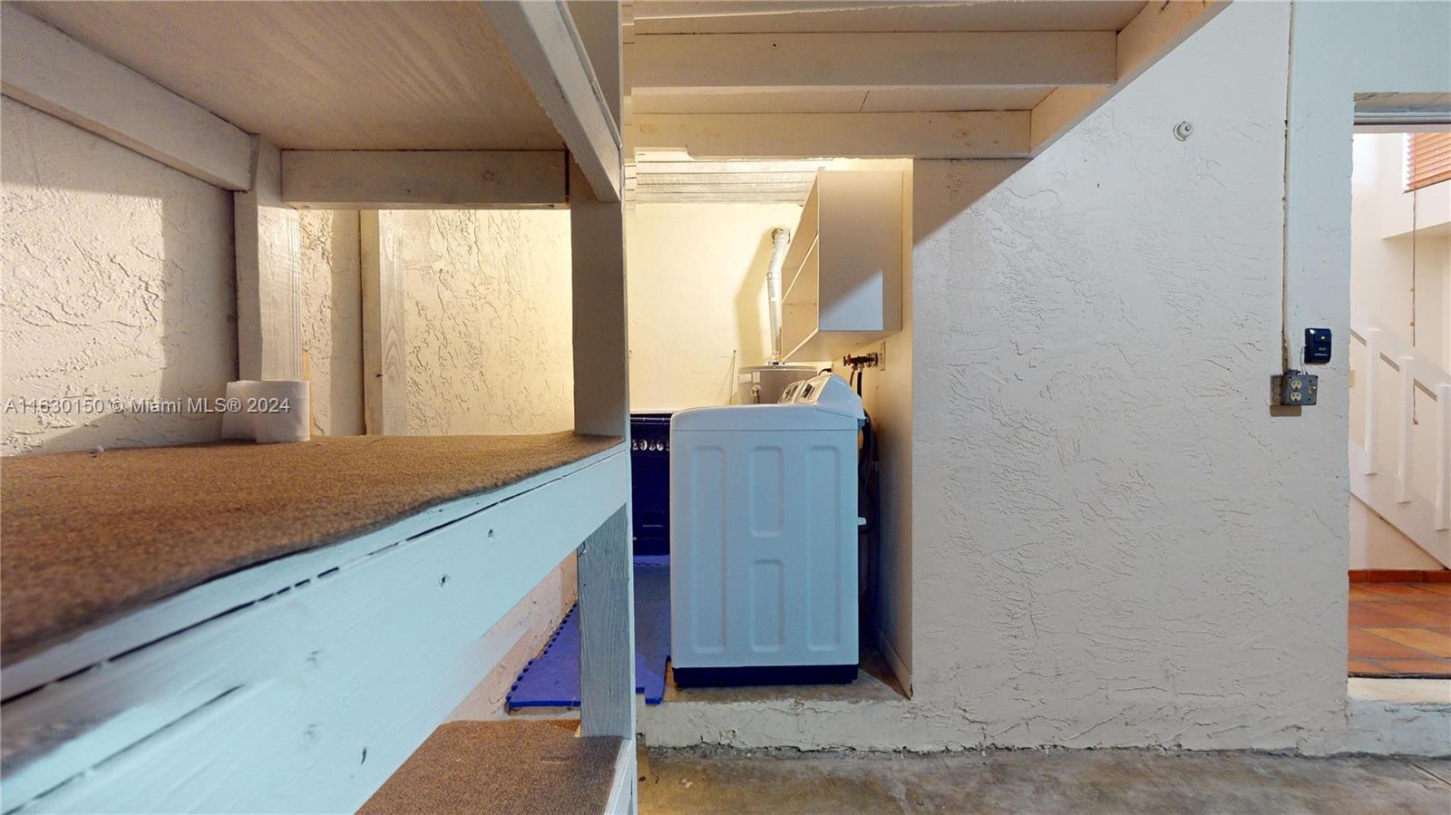 10665 Southwest 113th Place, Unit 95D Miami, FL 33176 - Photo 30 of 42 a view of a kitchen with a sink and a window