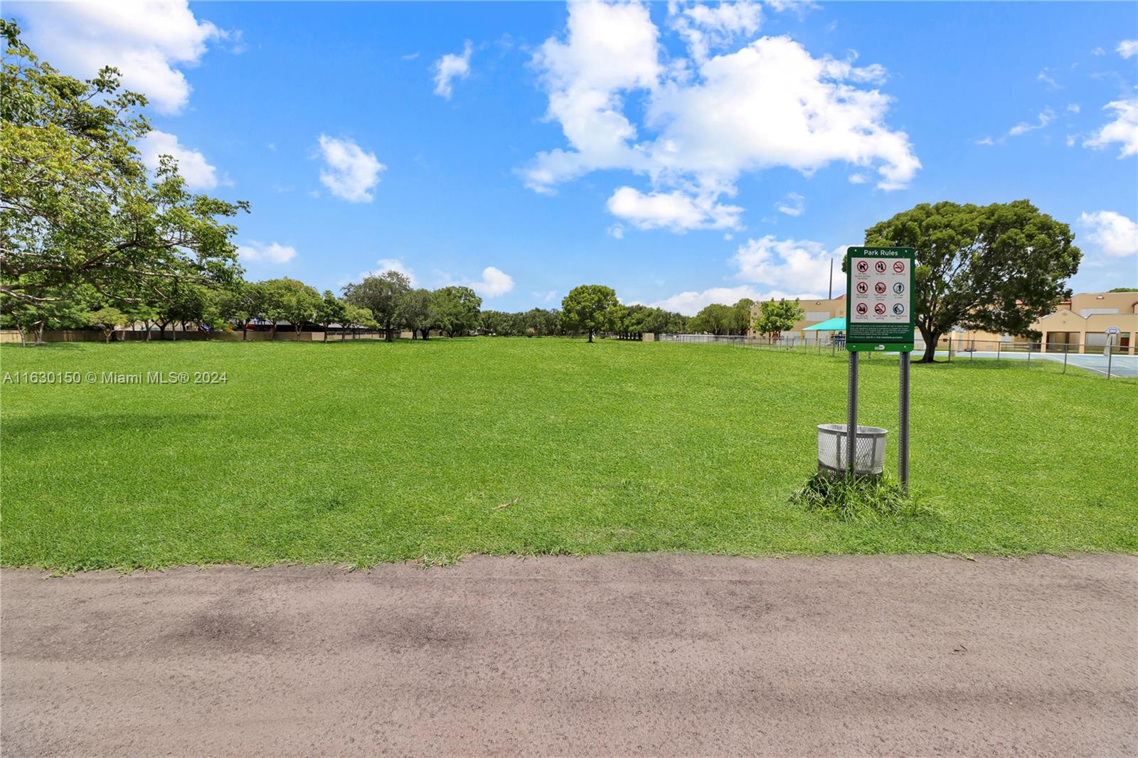 10665 Southwest 113th Place, Unit 95D Miami, FL 33176 - Photo 33 of 42 a view of a garden with a slide