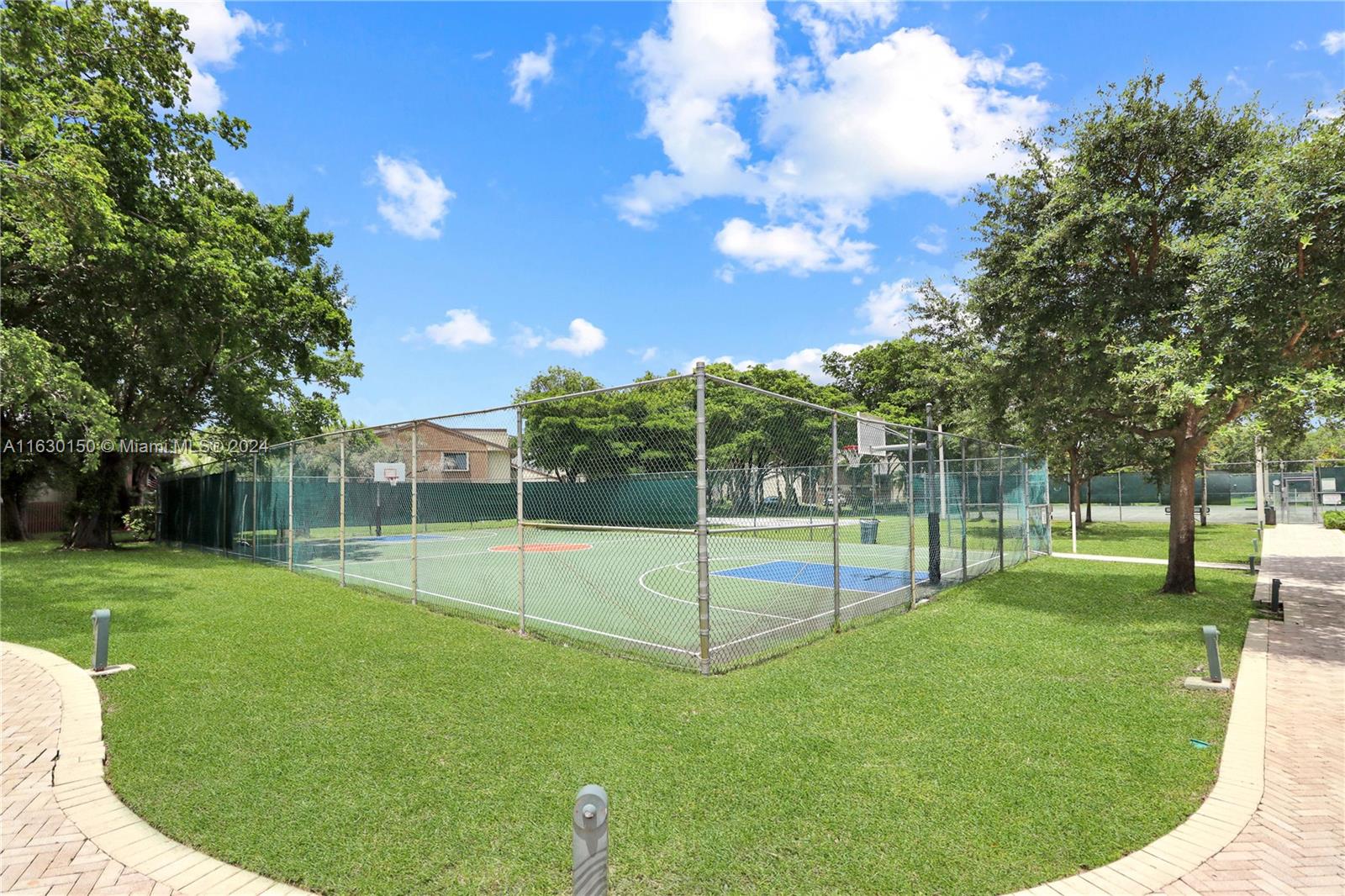 10665 Southwest 113th Place, Unit 95D Miami, FL 33176 - Photo 38 of 42 a view of a park with a slide