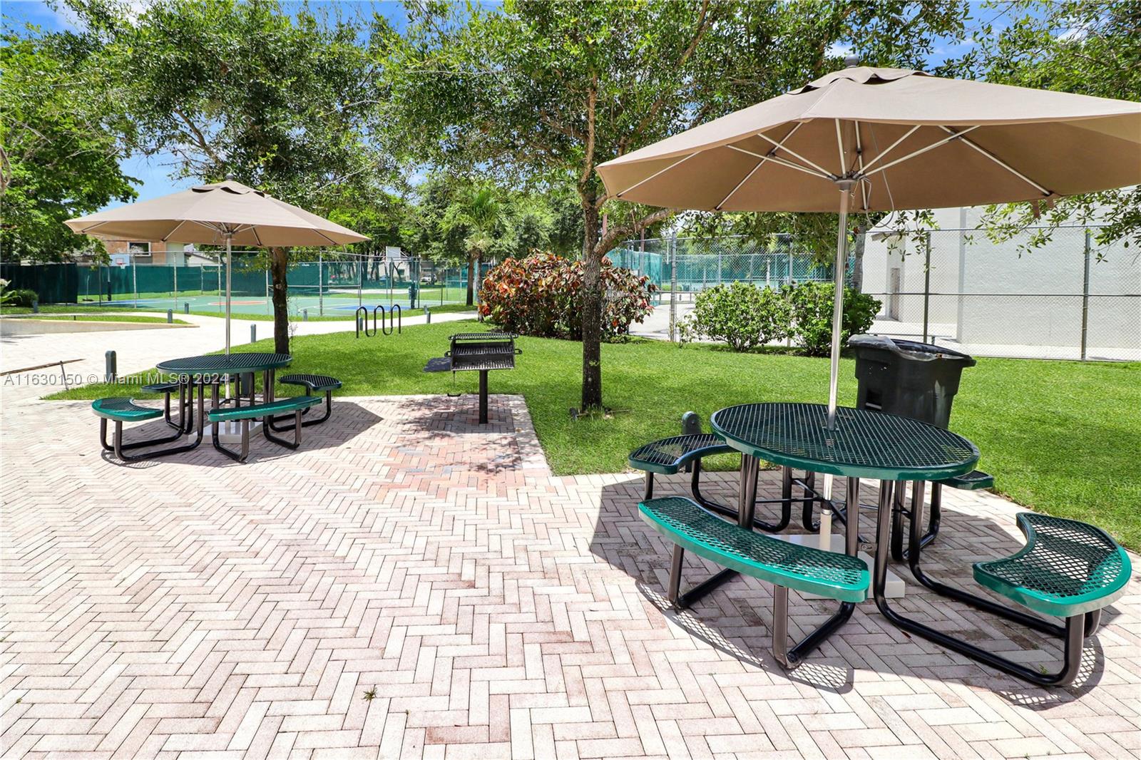 10665 Southwest 113th Place, Unit 95D Miami, FL 33176 - Photo 42 of 42 a view of a sitting area with furniture and backyard