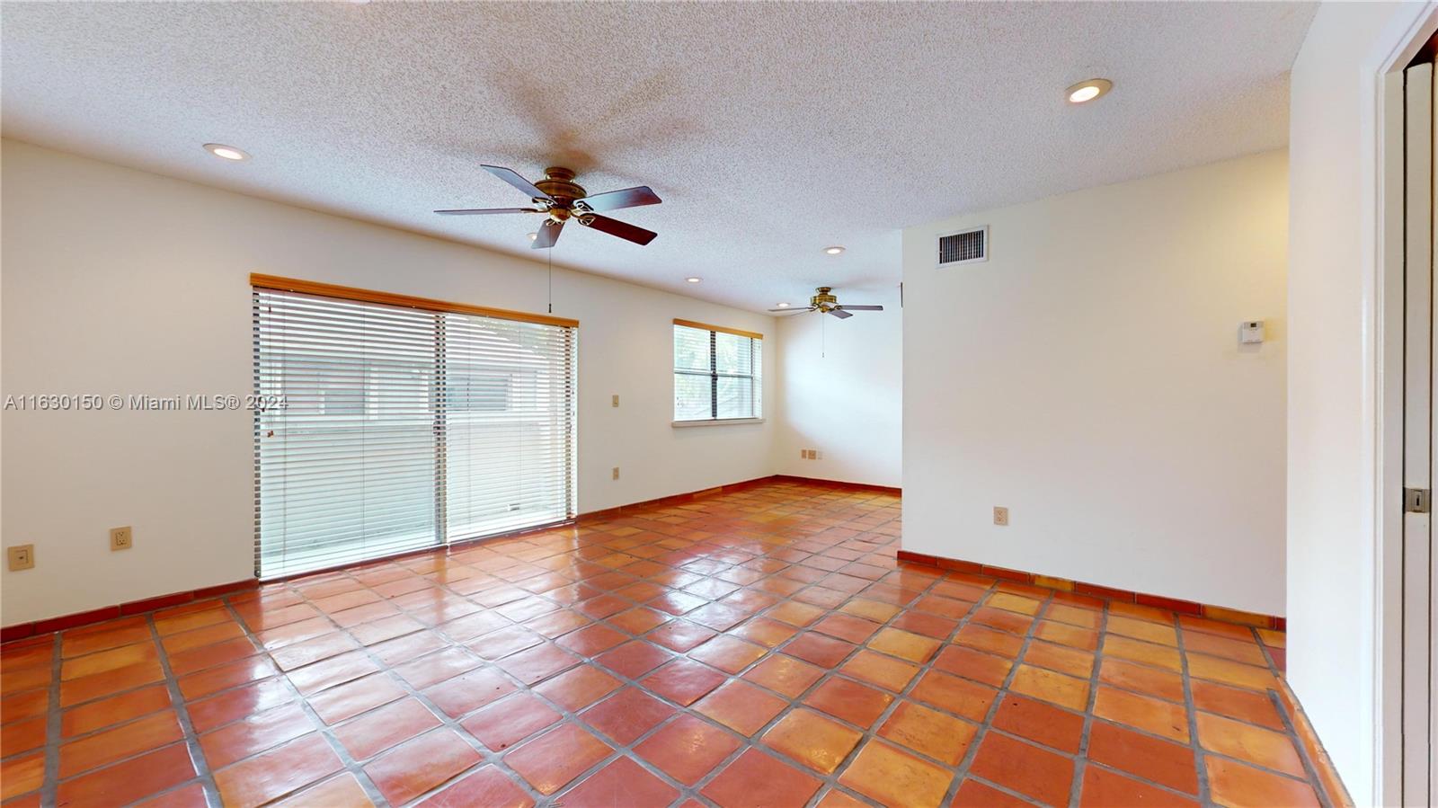 10665 Southwest 113th Place, Unit 95D Miami, FL 33176 - Photo 7 of 42 wooden floor in an empty room with a window