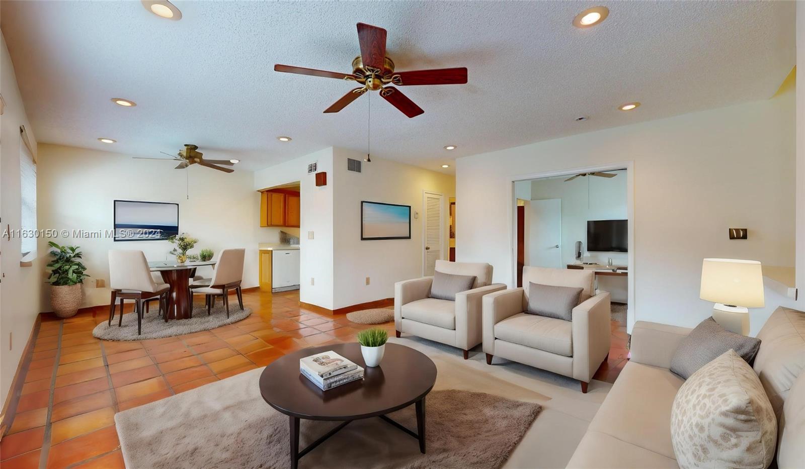 10665 Southwest 113th Place, Unit 95D Miami, FL 33176 - Photo 8 of 42 a living room with furniture and a wooden floor