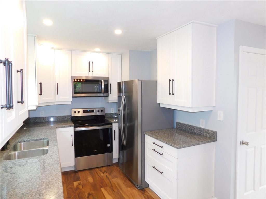 2413 Kane Road Aliquippa, PA 15001 - Photo 5 of 14 Brand new Renovated Kitchen with UPGRADES that include, Granite Counter Tops, Soft close Cabinets and Stainless Steel appliances!