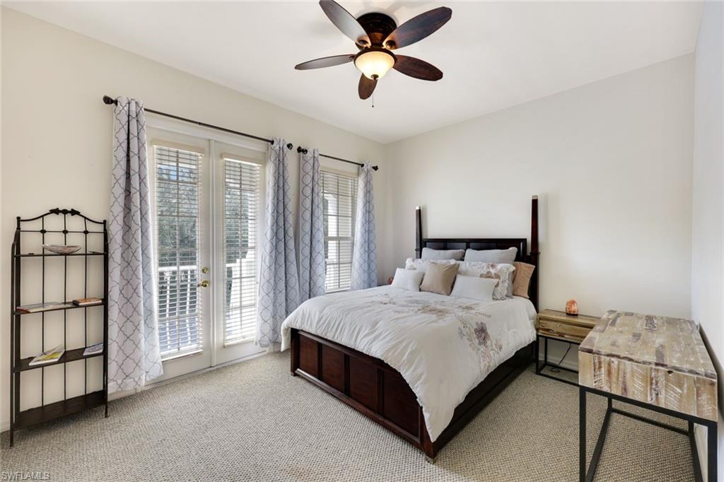 3530 Lansing Loop, Unit 202 Estero, FL 33928 - Photo 7 of 35 a bed sitting in a room next to a window