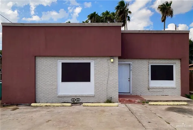a front view of a house with a garage