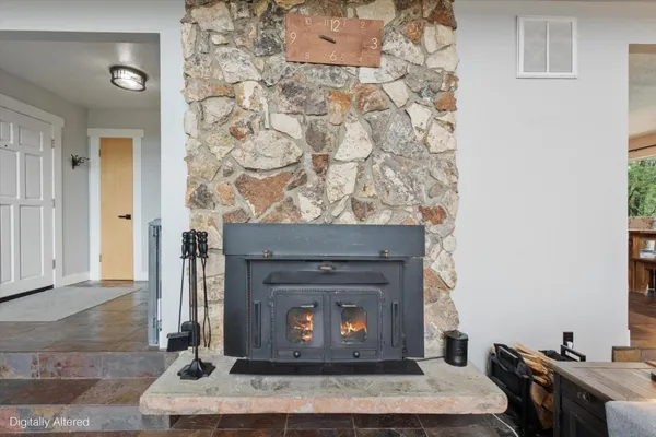 a kitchen with stainless steel appliances a stove a sink and white cabinets