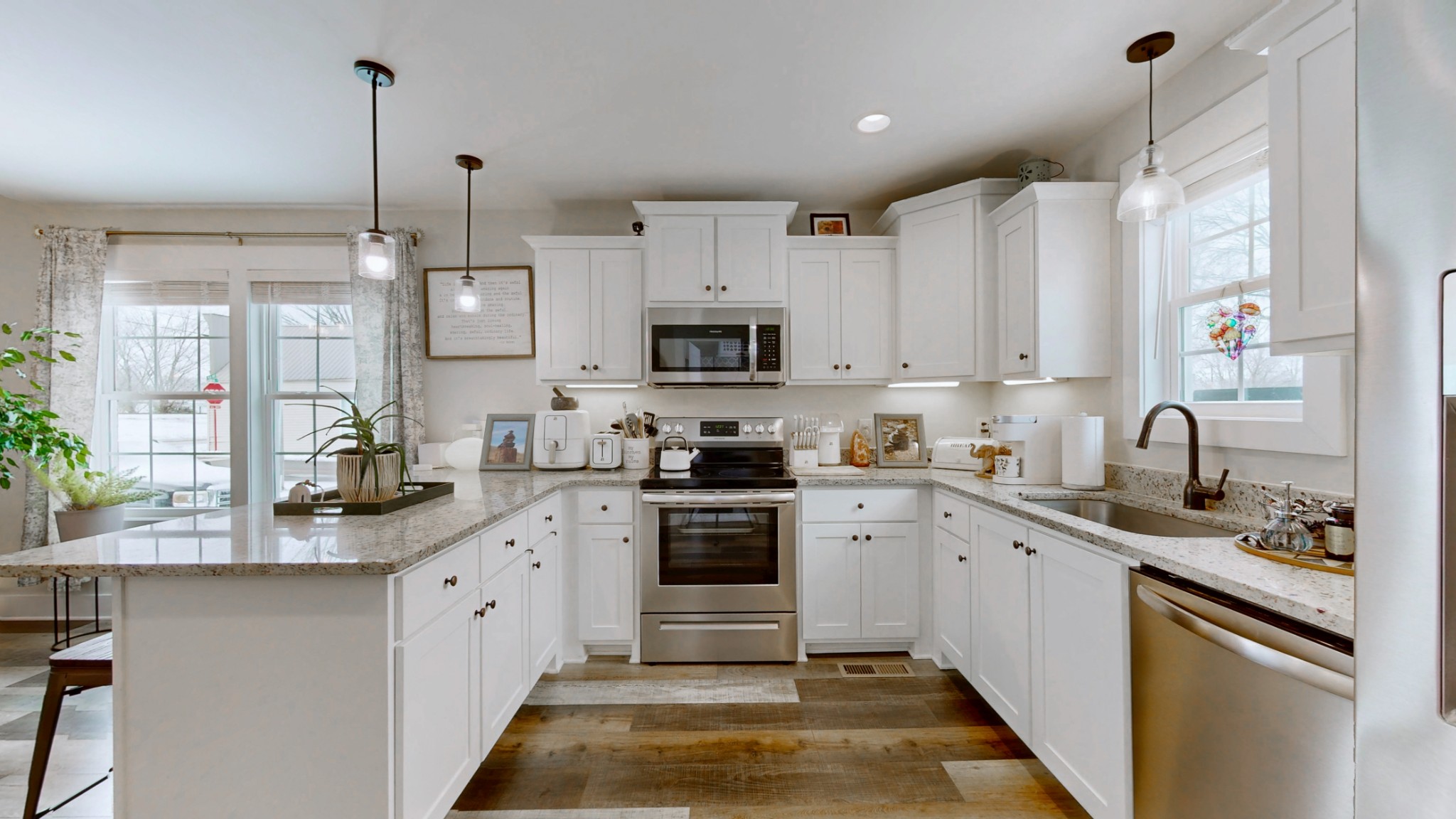 1093 Main Street Greenbrier, TN 37073 - Photo 6 of 26 a kitchen with stainless steel appliances granite countertop a sink stove and refrigerator