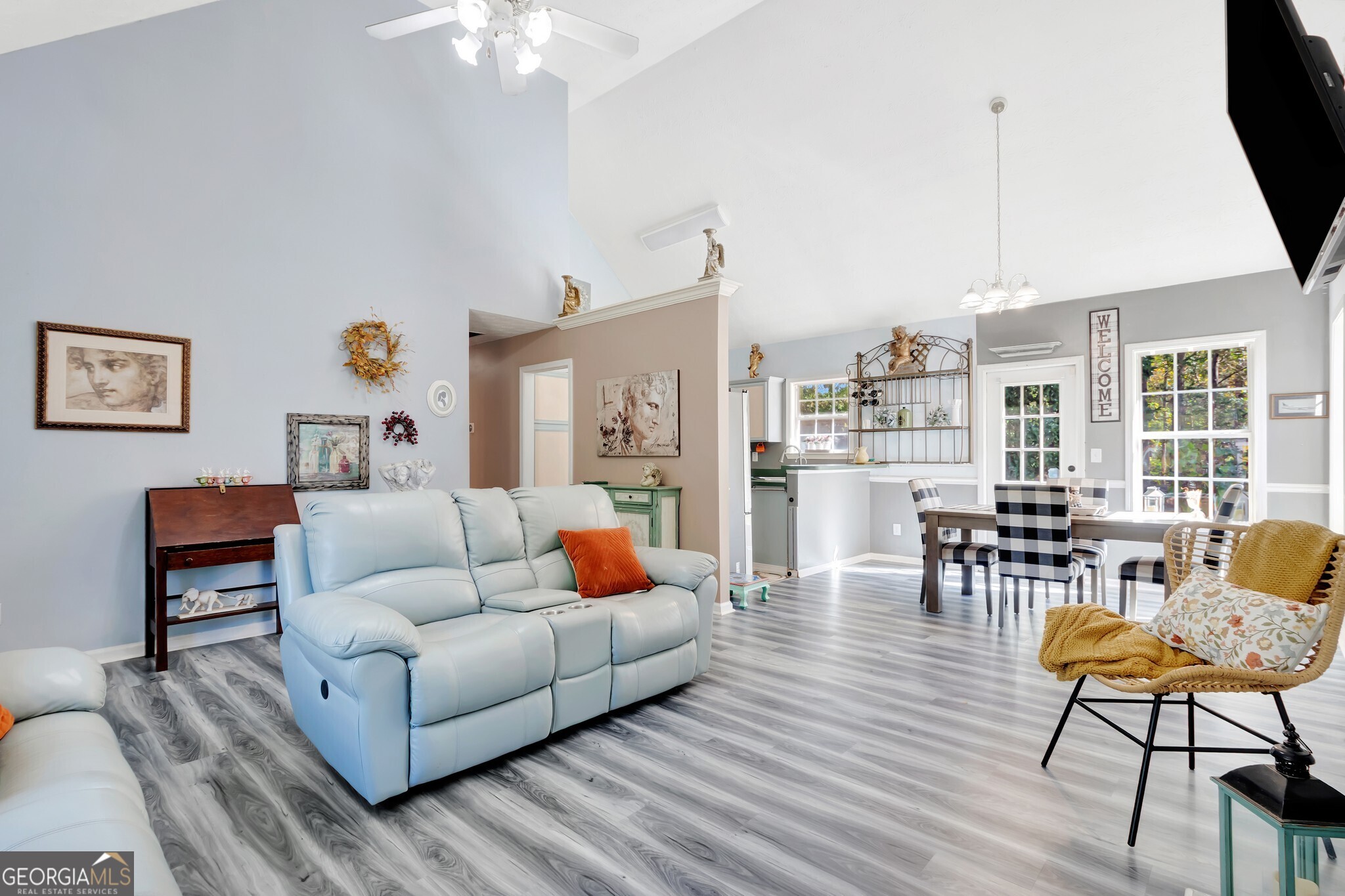 2040 Elm Grove Lane Hampton, GA 30228 - Photo 11 of 38 a living room with furniture and a chandelier