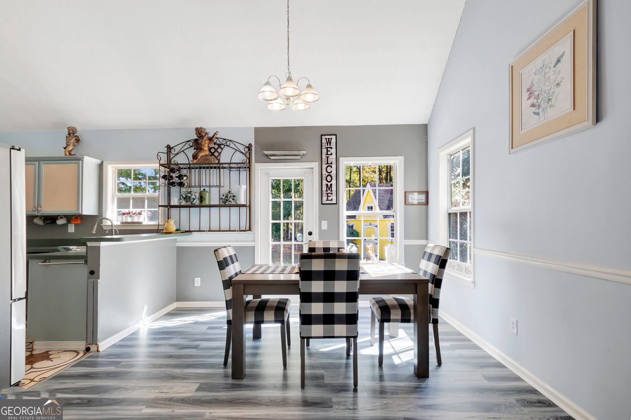 2040 Elm Grove Lane Hampton, GA 30228 - Photo 12 of 38 a view of a dining room with furniture window and wooden floor