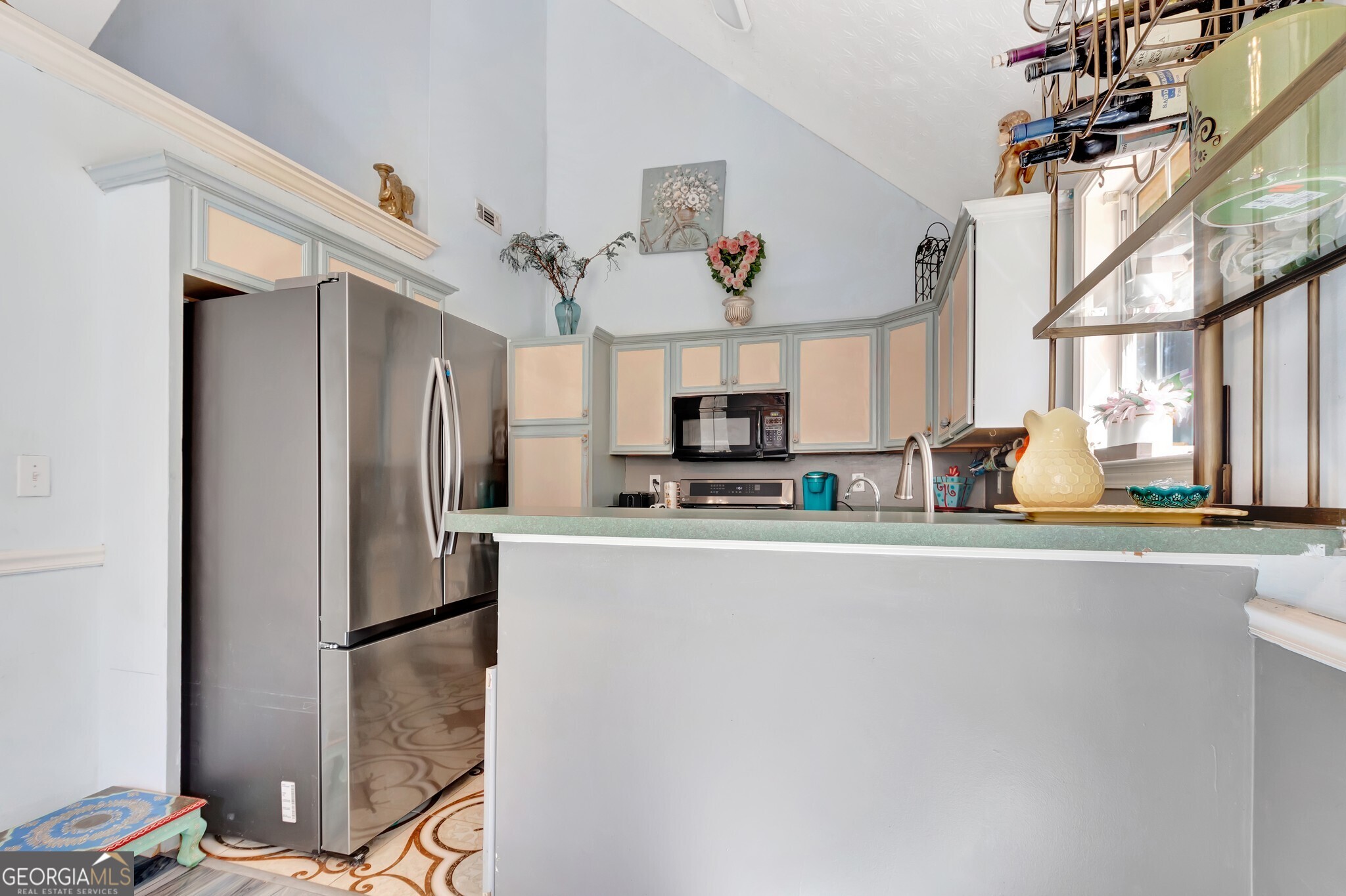 2040 Elm Grove Lane Hampton, GA 30228 - Photo 15 of 38 a kitchen with stainless steel appliances a refrigerator and a stove top oven