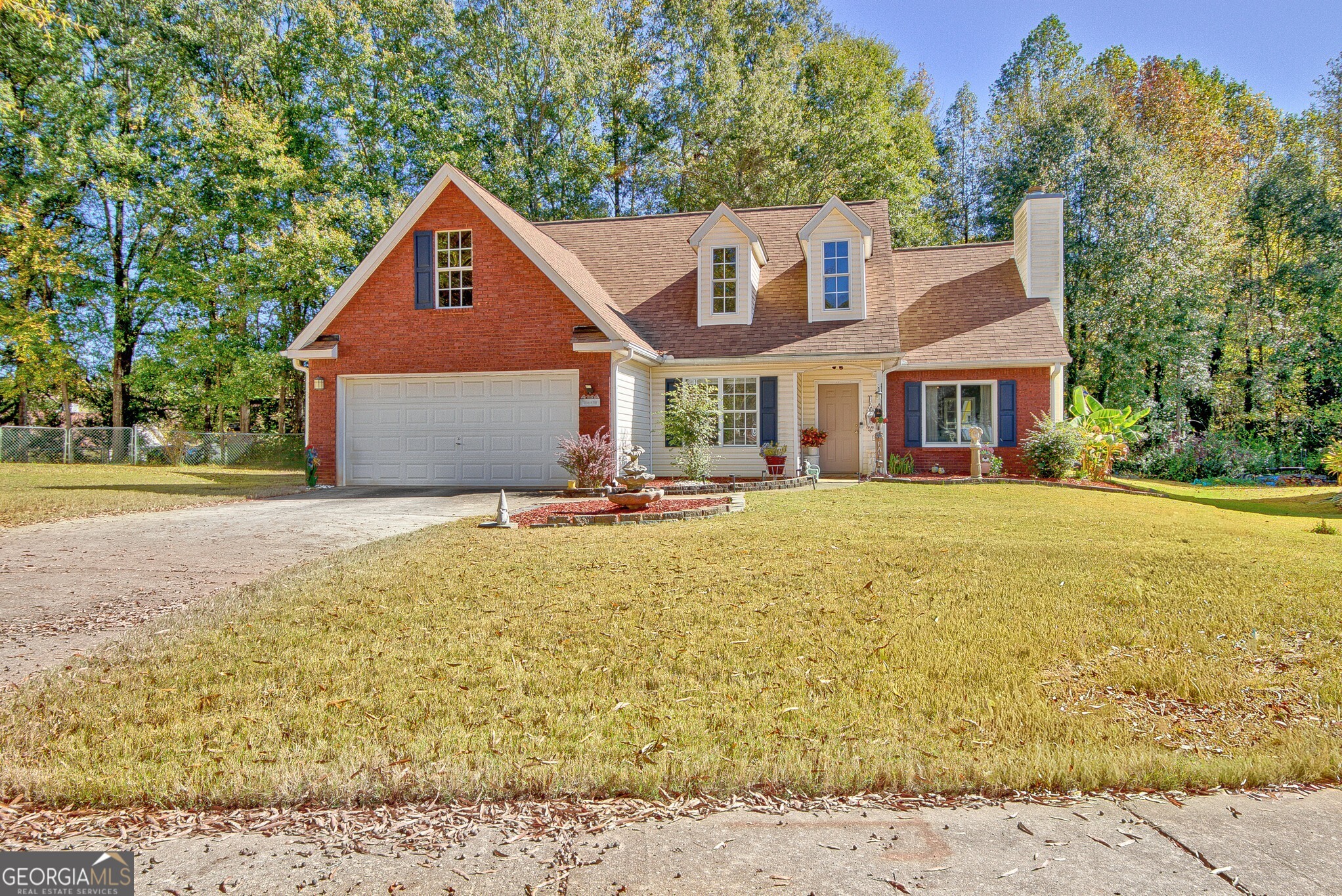 2040 Elm Grove Lane Hampton, GA 30228 - Photo 2 of 38 a front view of a house with a yard