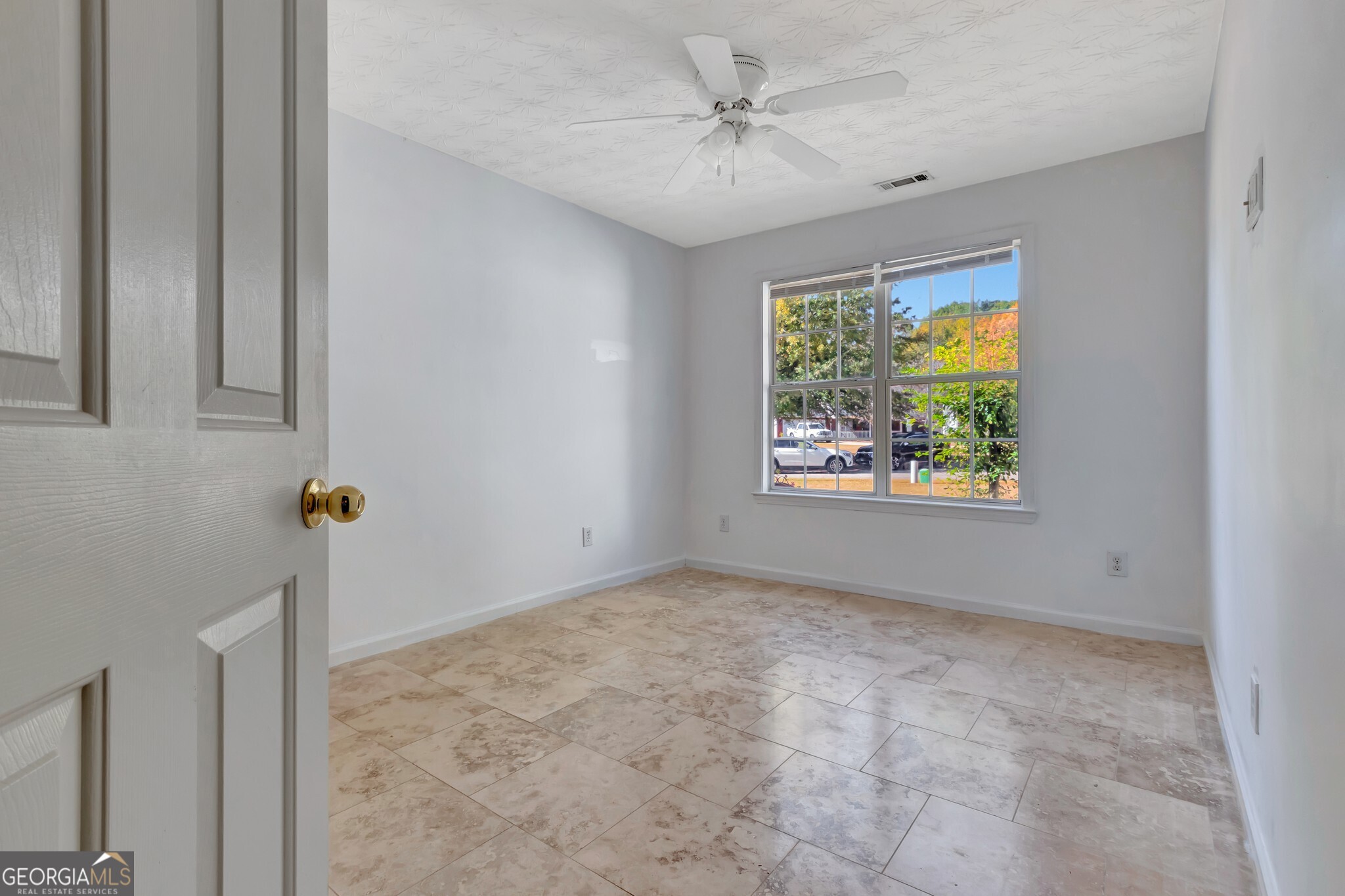 2040 Elm Grove Lane Hampton, GA 30228 - Photo 22 of 38 a view of an empty room with a window