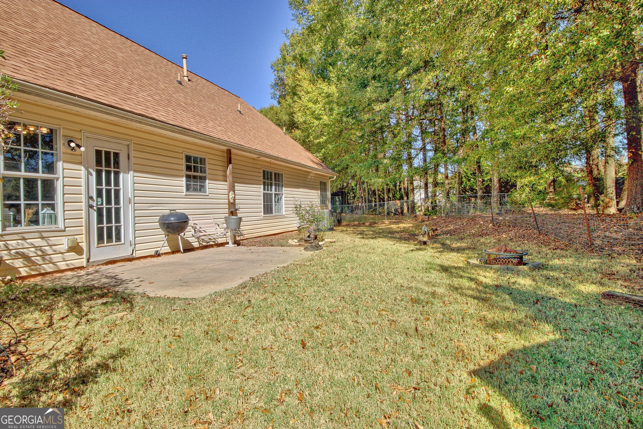 2040 Elm Grove Lane Hampton, GA 30228 - Photo 31 of 38 a view of a backyard with a tree