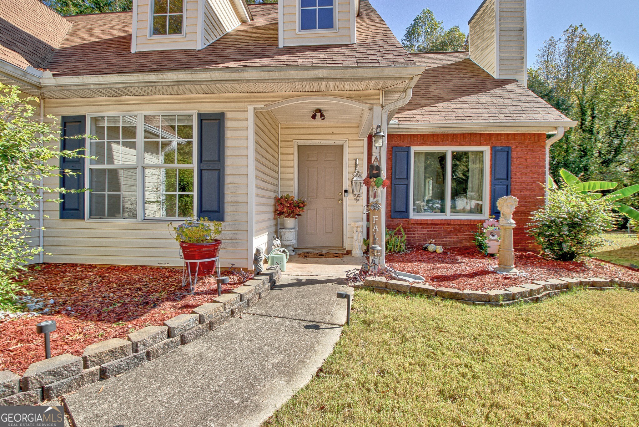 2040 Elm Grove Lane Hampton, GA 30228 - Photo 4 of 38 a front view of a house with an outdoor seating