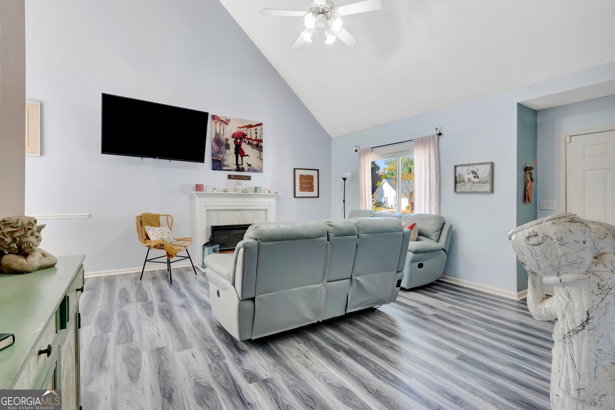 2040 Elm Grove Lane Hampton, GA 30228 - Photo 9 of 38 a living room with furniture and a flat screen tv