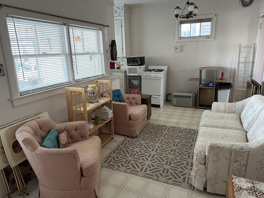 9 Shea Street Salisbury, MA 01952 - Photo 2 of 8 a living room with furniture and a window