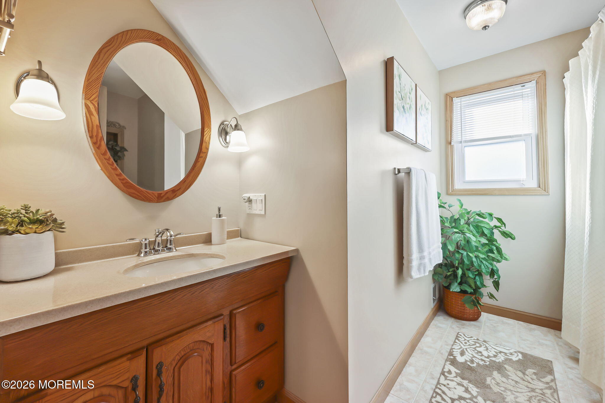 31 Sweetbriar Trail Howell, NJ 07731 - Photo 16 of 43 a bathroom with a sink and a mirror