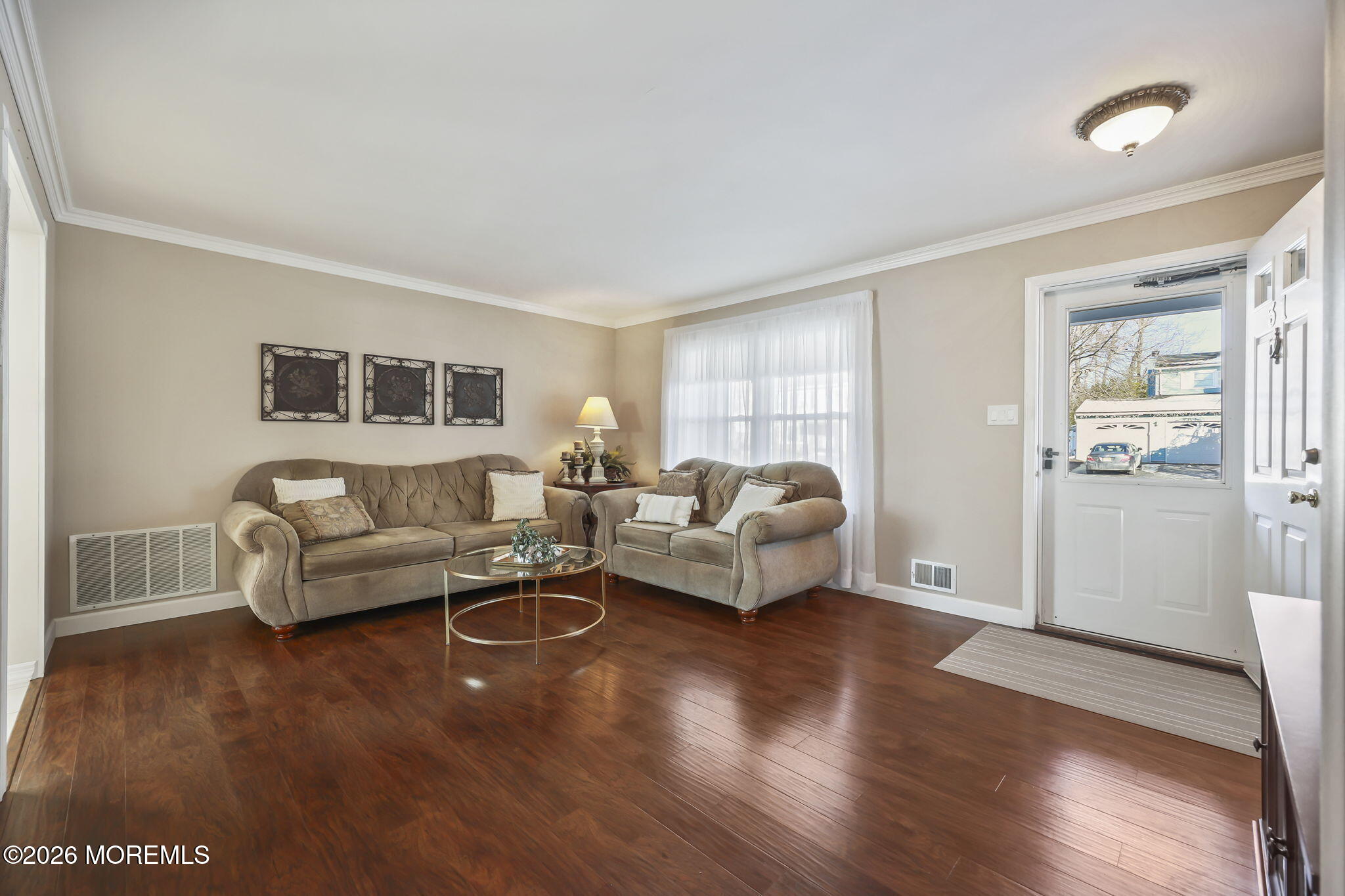 31 Sweetbriar Trail Howell, NJ 07731 - Photo 27 of 43 a living room with furniture and a wooden floor