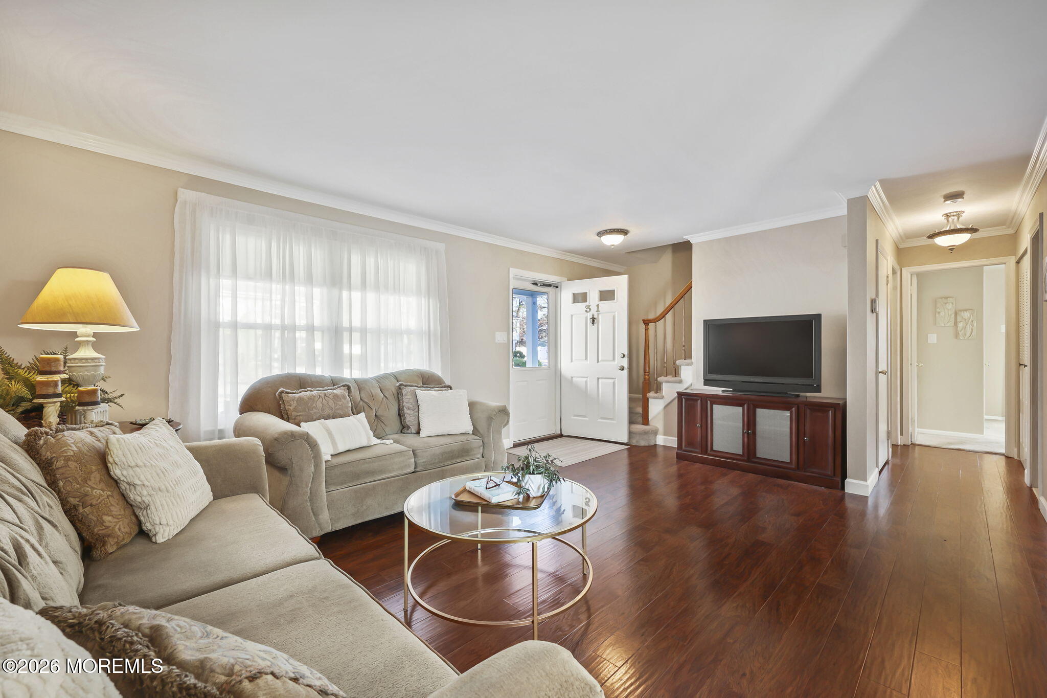 31 Sweetbriar Trail Howell, NJ 07731 - Photo 28 of 43 a living room with furniture and a flat screen tv