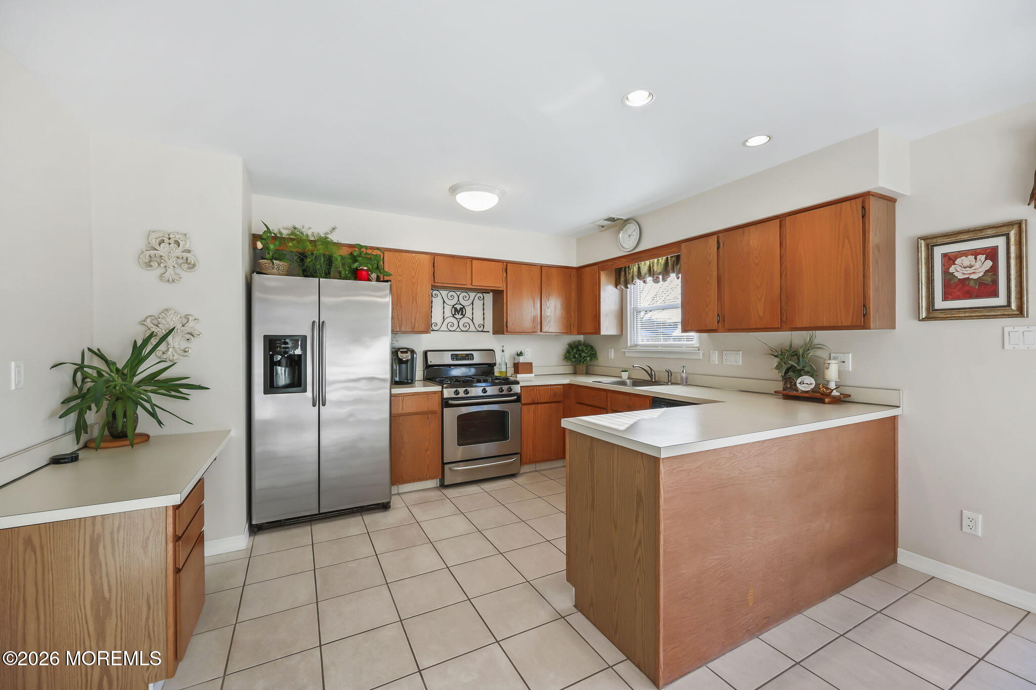 31 Sweetbriar Trail Howell, NJ 07731 - Photo 29 of 43 a kitchen with a sink a stove and refrigerator