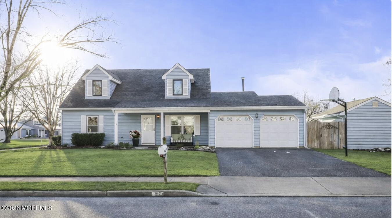 31 Sweetbriar Trail Howell, NJ 07731 - Photo 37 of 43 a front view of a house with a garden and plants