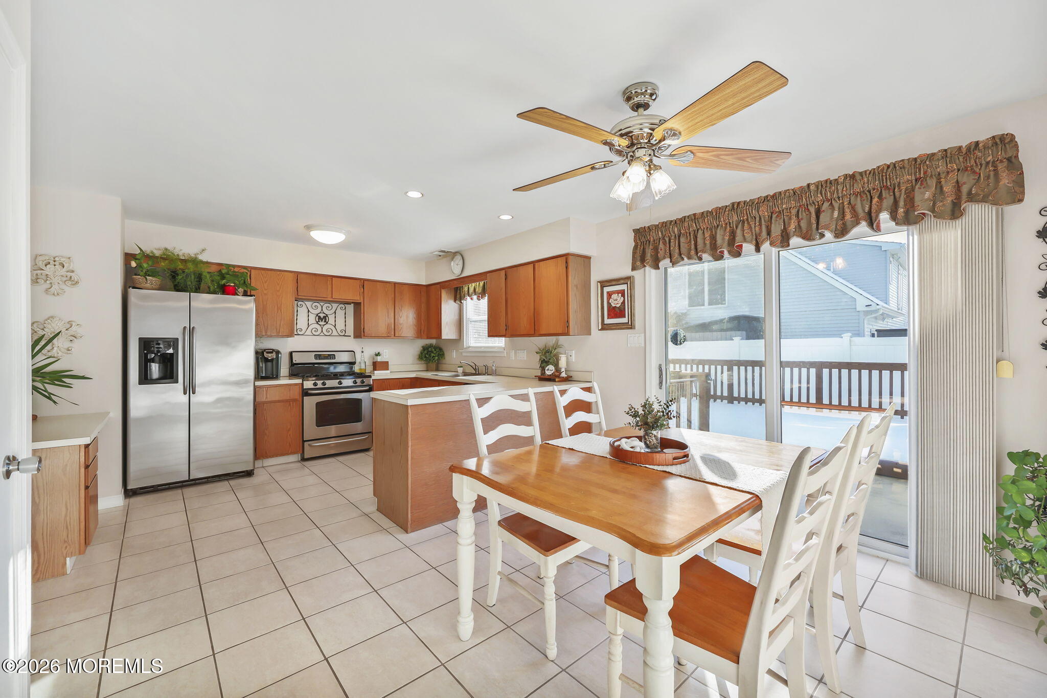 31 Sweetbriar Trail Howell, NJ 07731 - Photo 5 of 43 a dining hall with stainless steel appliances a table and chairs