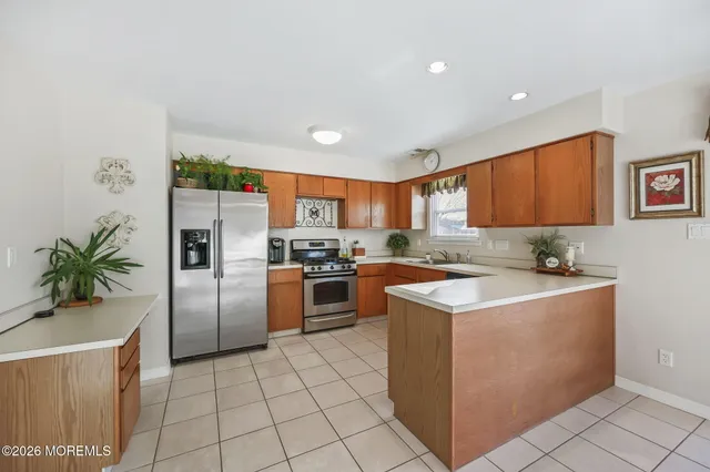 a kitchen with a sink a stove and refrigerator
