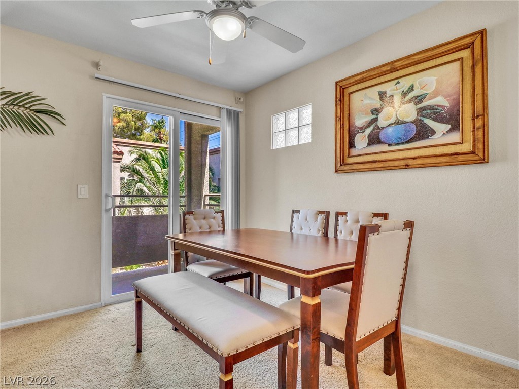 3145 East Flamingo Road, Unit 2129 Las Vegas, NV 89121 - Photo 10 of 43 A well-lit dining area offers a seamless transition to an inviting outdoor space.
