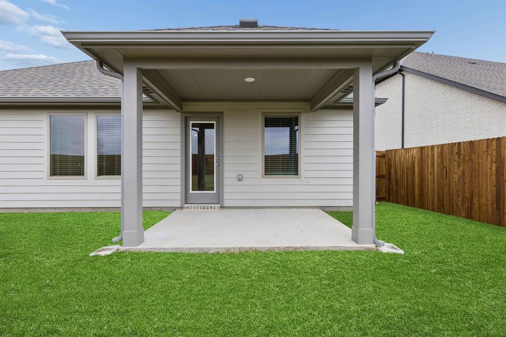 1124 Del Rio Drive Lavon, TX 75166 - Photo 28 of 32 Covered Patio in the Emmy II home plan by Trophy Signature Homes - REPRESENTATIVE PHOTO